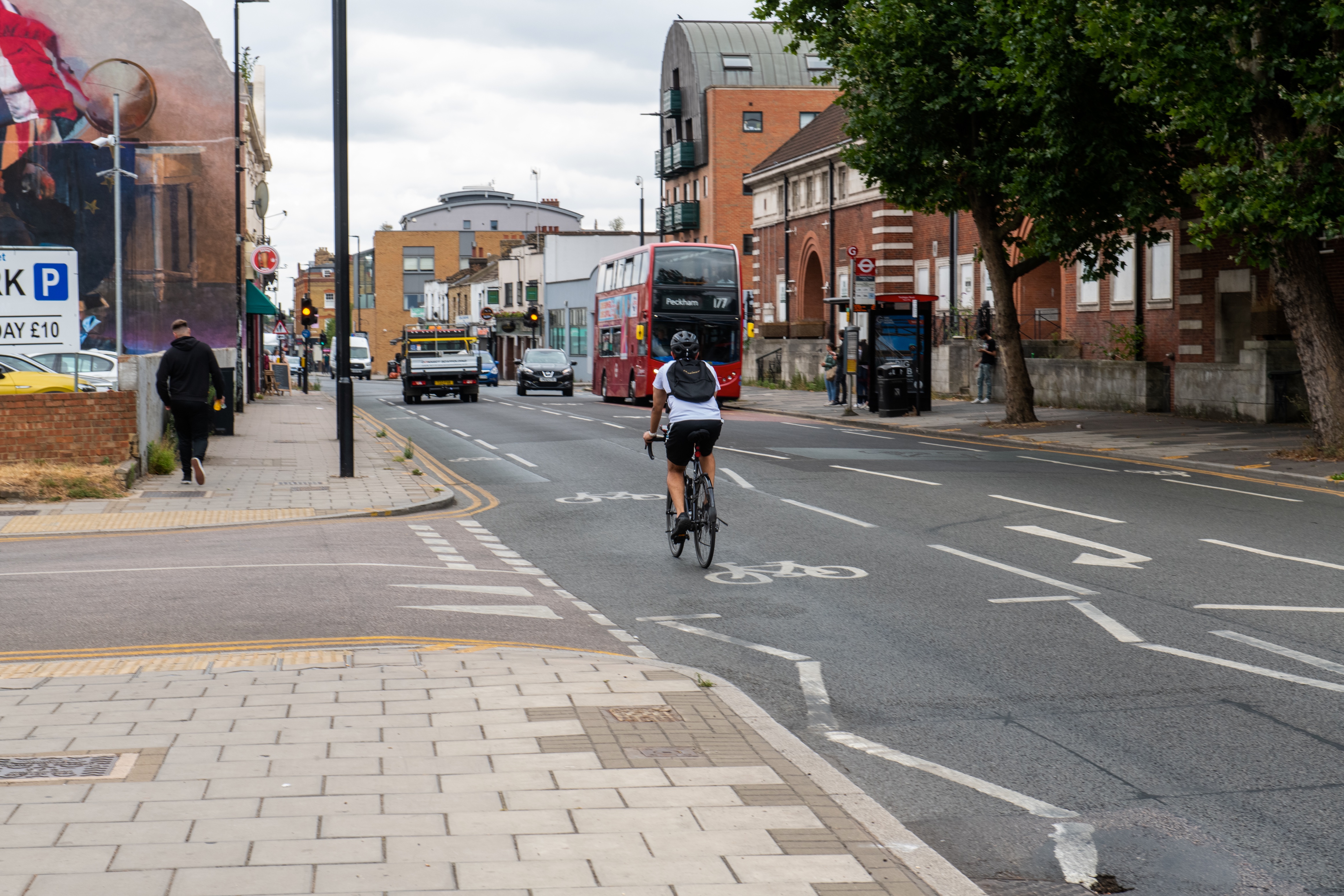 Cyclist, bus and cars in Royal Greenwich