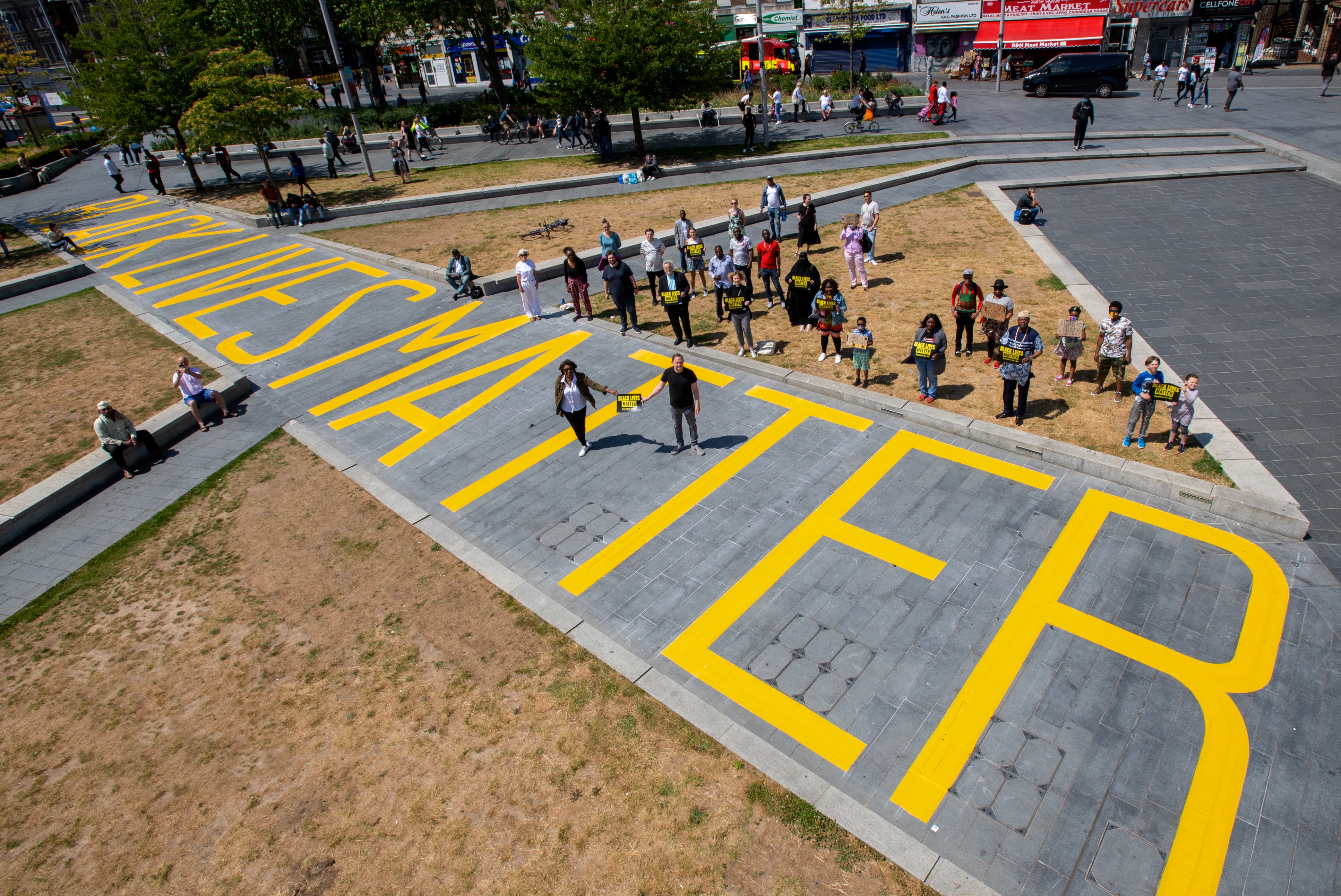 Black Lives Matter written across General Gordon Square. Leader and Deputy Leader standing on the crossing.
