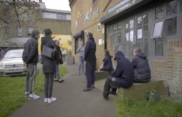 People wait outside Deptford Reach to receive their coronavirus vaccination.