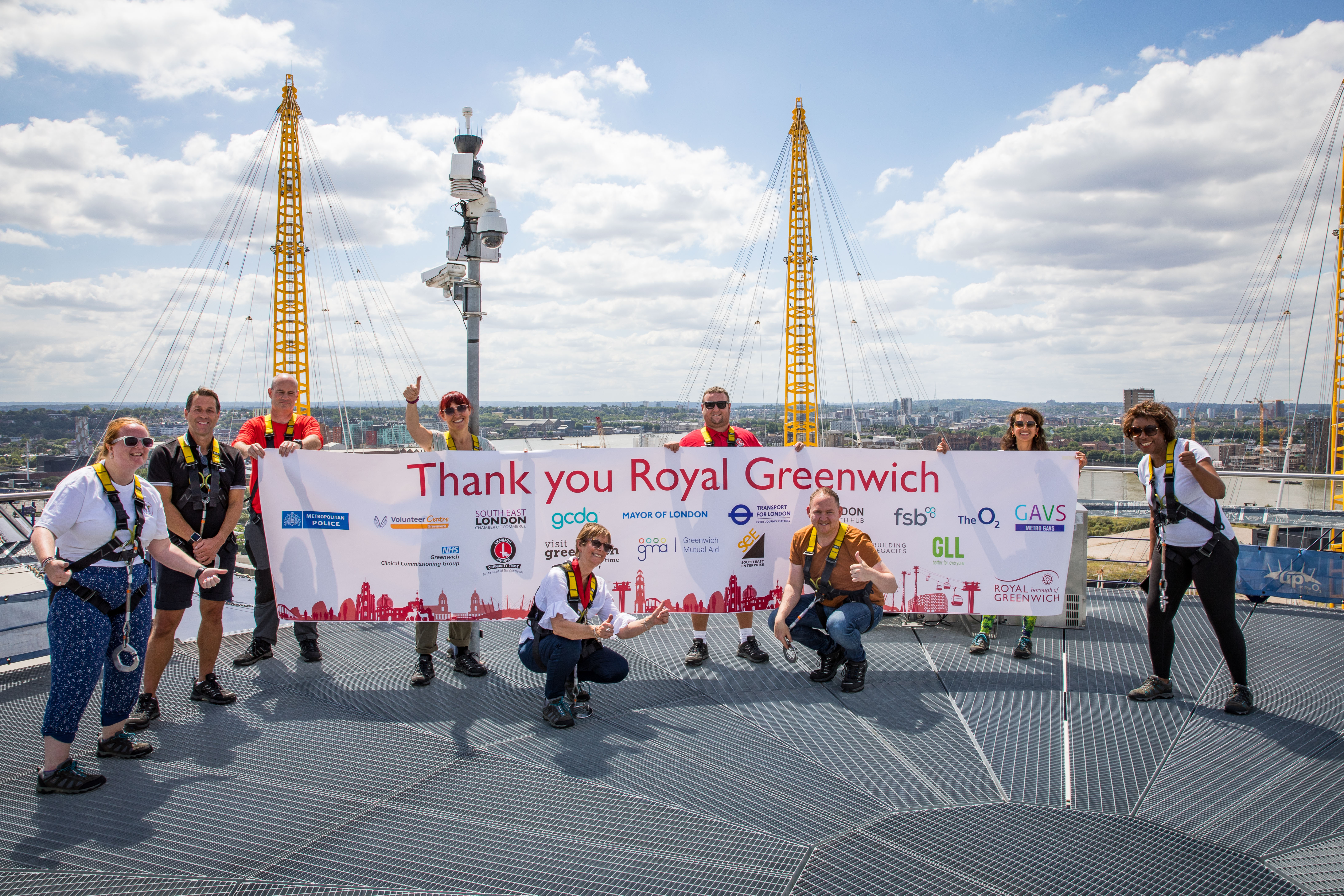 Danny Thorpe and representatives from local organisations hold banner thanking the borough.