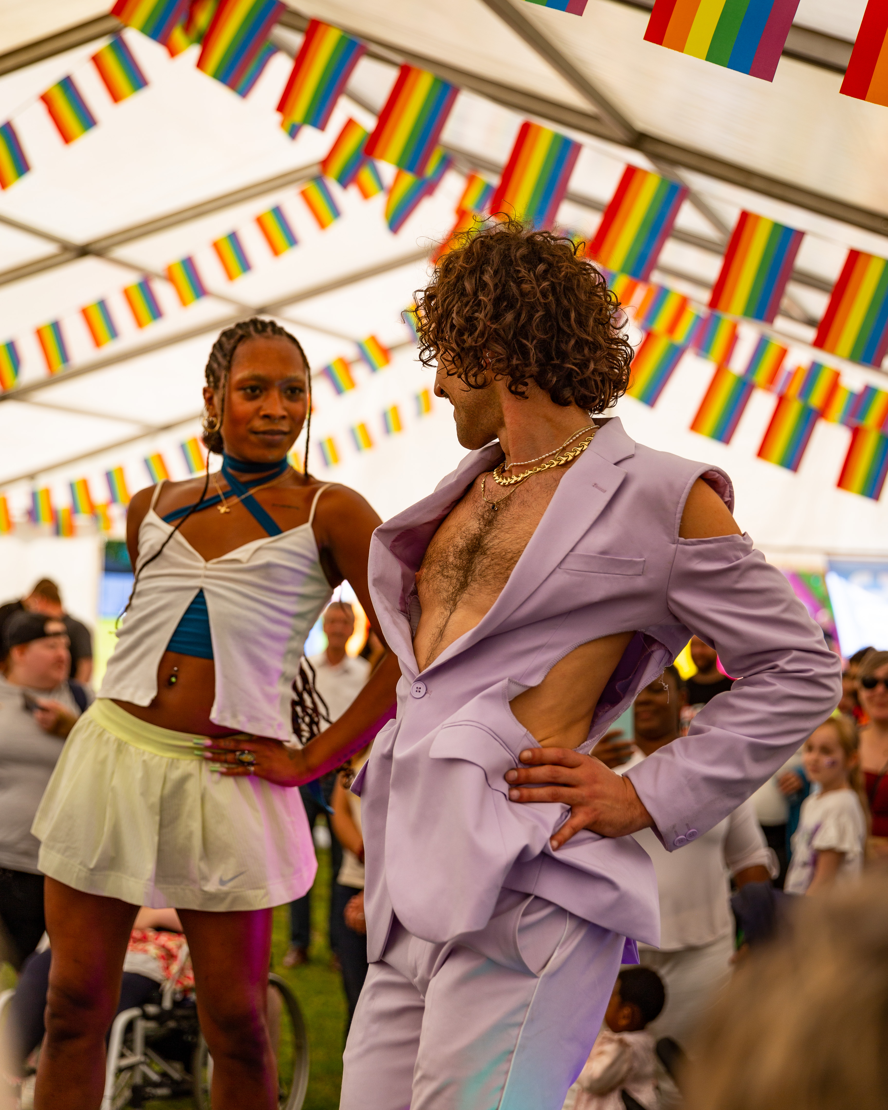 Two dancers look at each other as they perform a voguing workshop at last year's Together Fetsival. Above them is rainbow bunting.