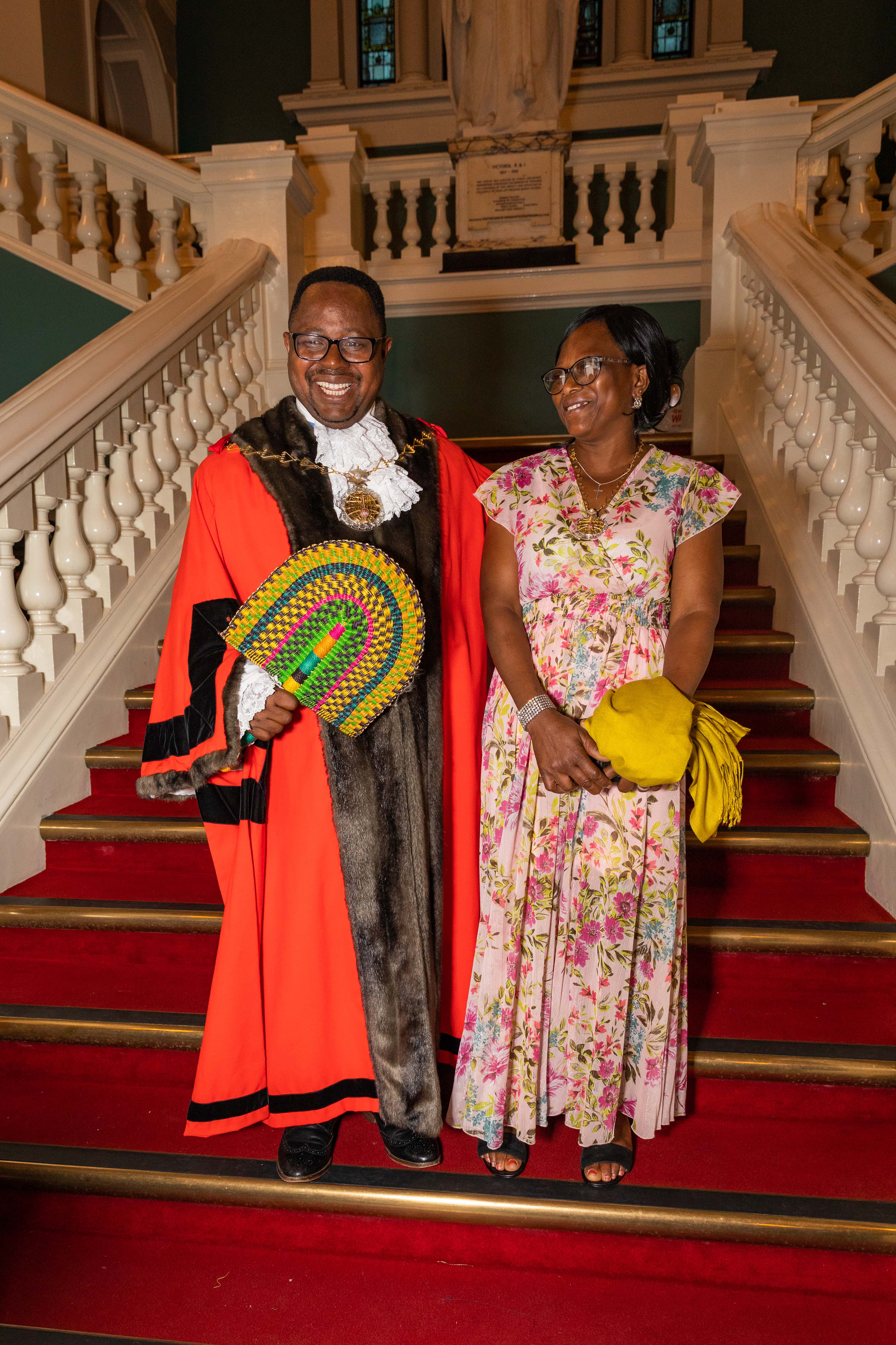 Mayor of Royal Greenwich, Cllr Dominic Mbang and Mayoress Mary Mbang on the stairs at the Town Hall