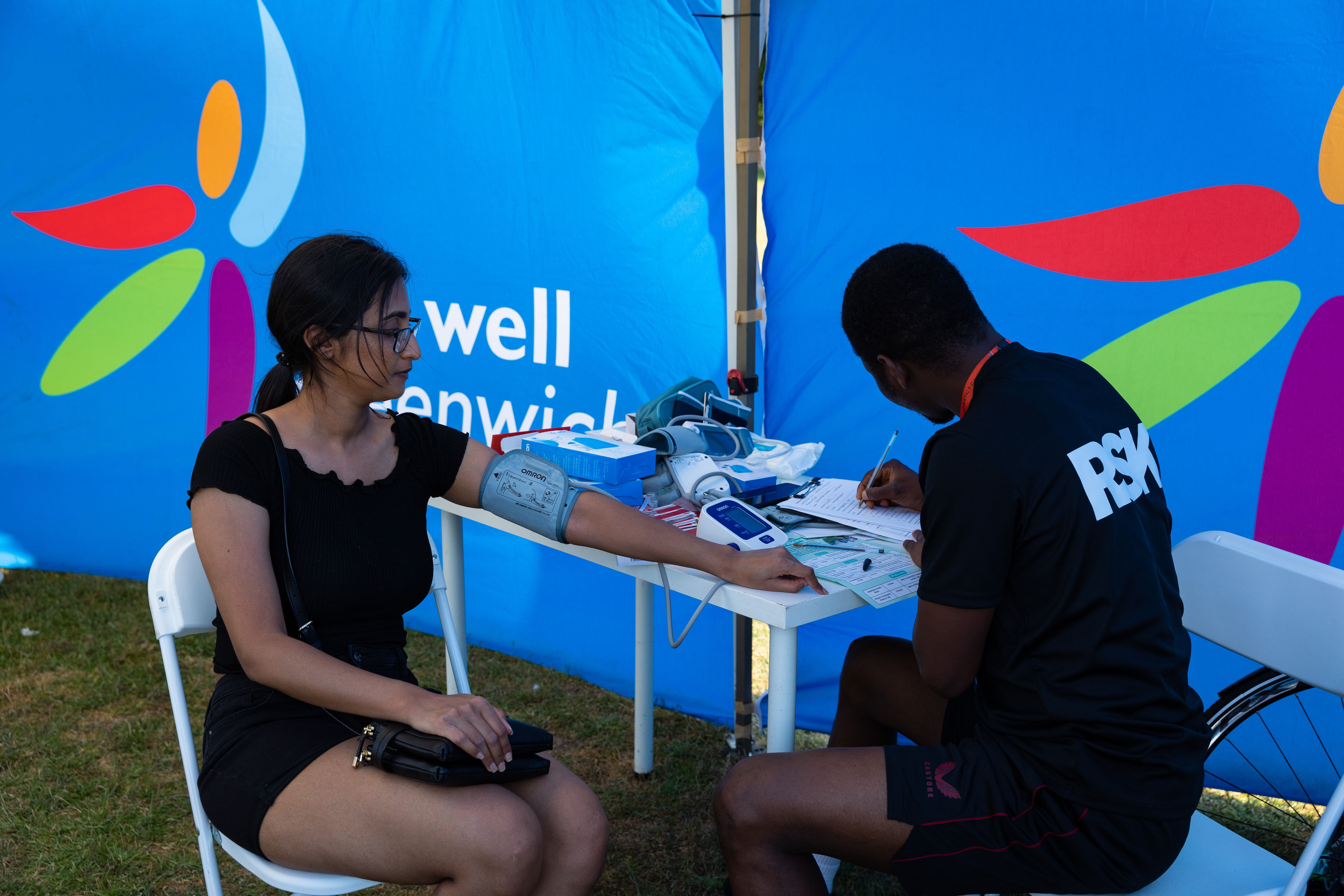 A woman getting her blood pressure checked