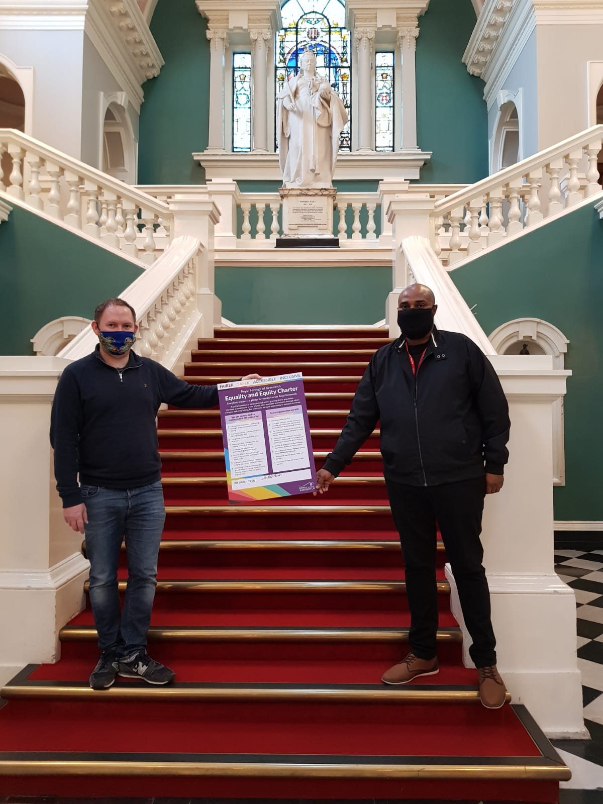 Cllr Danny Thorpe and Cllr Adel Khaireh, launch the borough’s first Equality and Equity Charter - on stairs of Town Hall holding up the Charter.