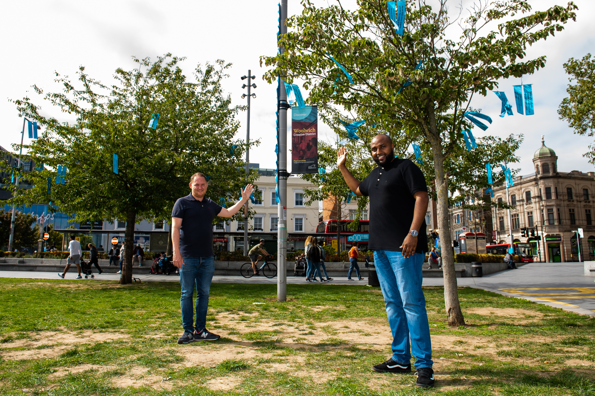 Cllr Thorpe and Cllr Khaireh by trees with blue ribbons on them in General Gordon Square