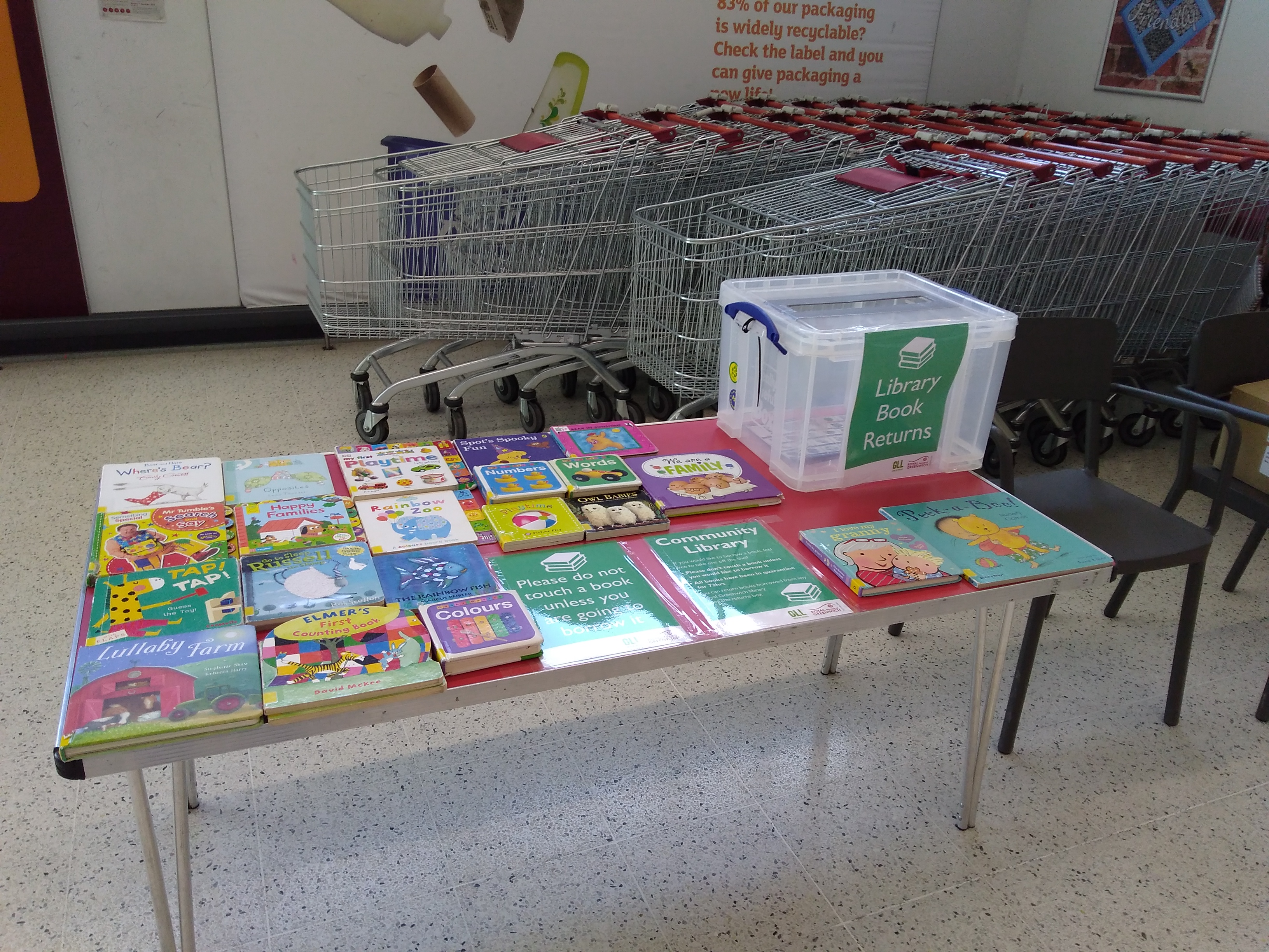 Table with library books on.