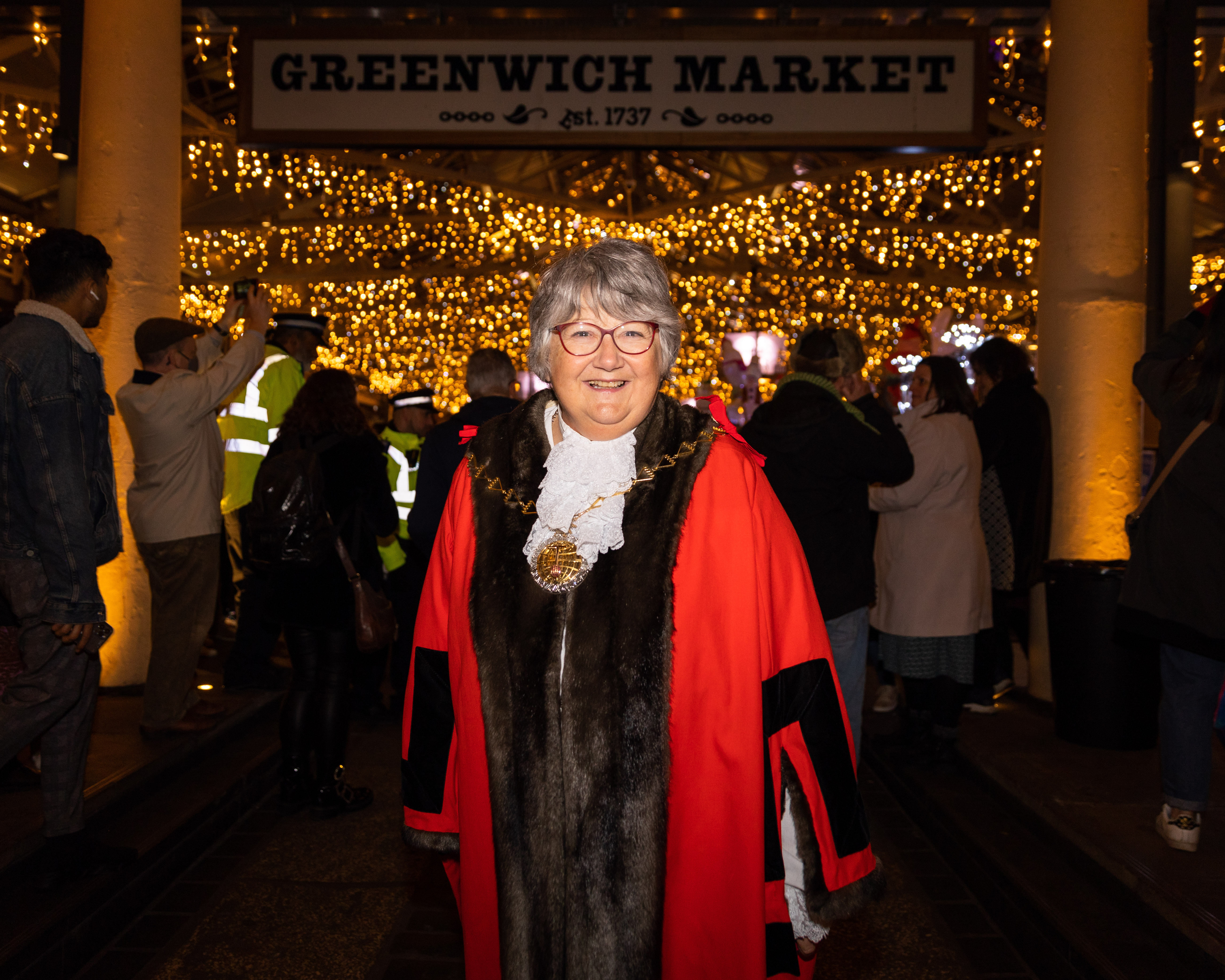 Cllr Densie Hyland in her Mayor robes standing infront of Greenwich Market.