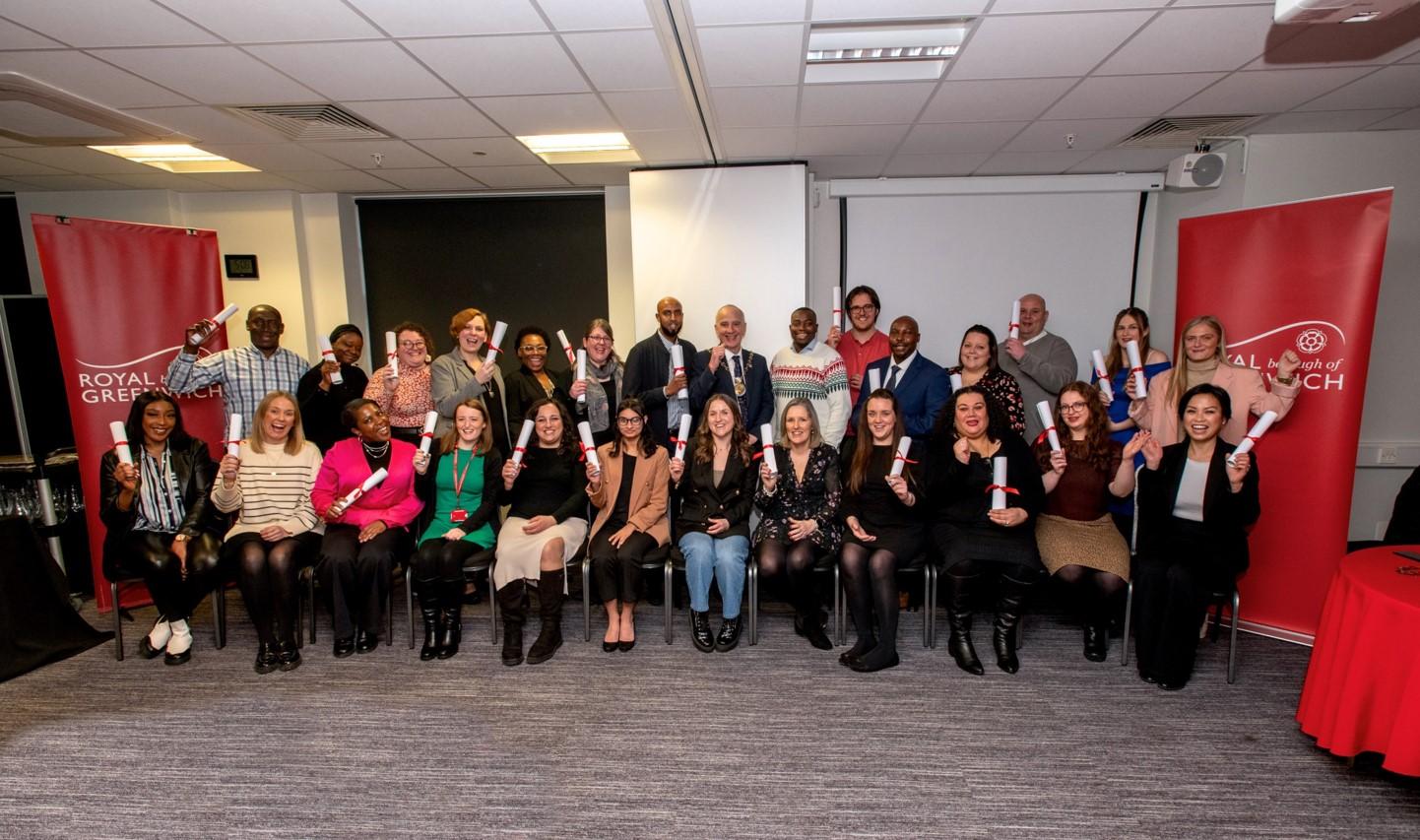 Apprenticeship graduates with their certificates