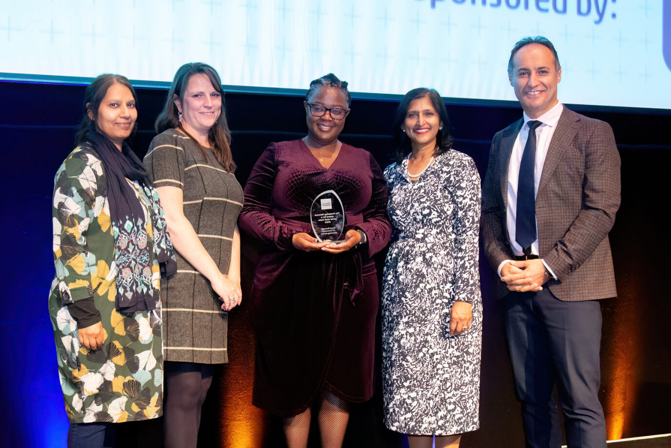 Fostering team with their award