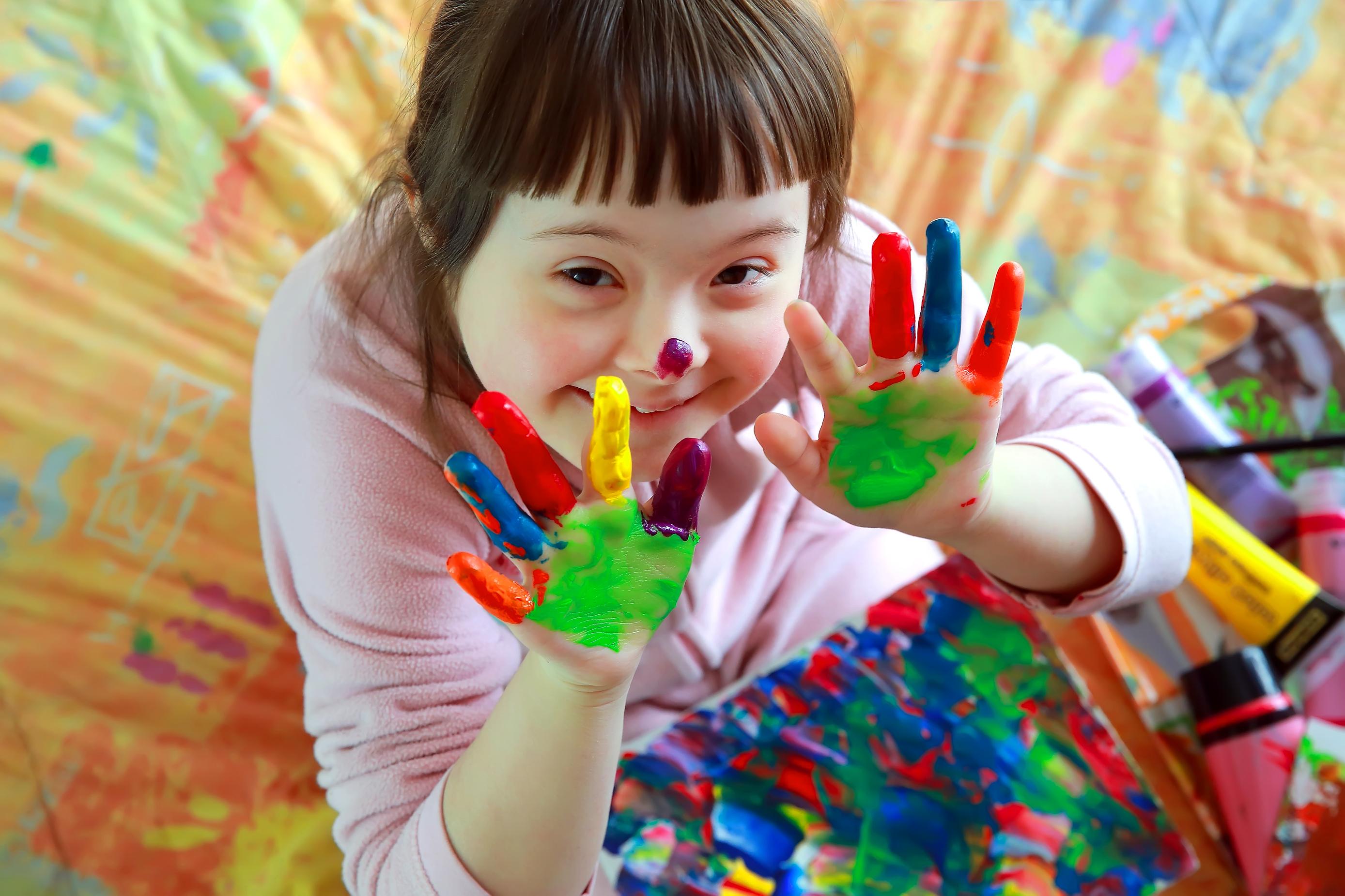 Child enjoying hand painting