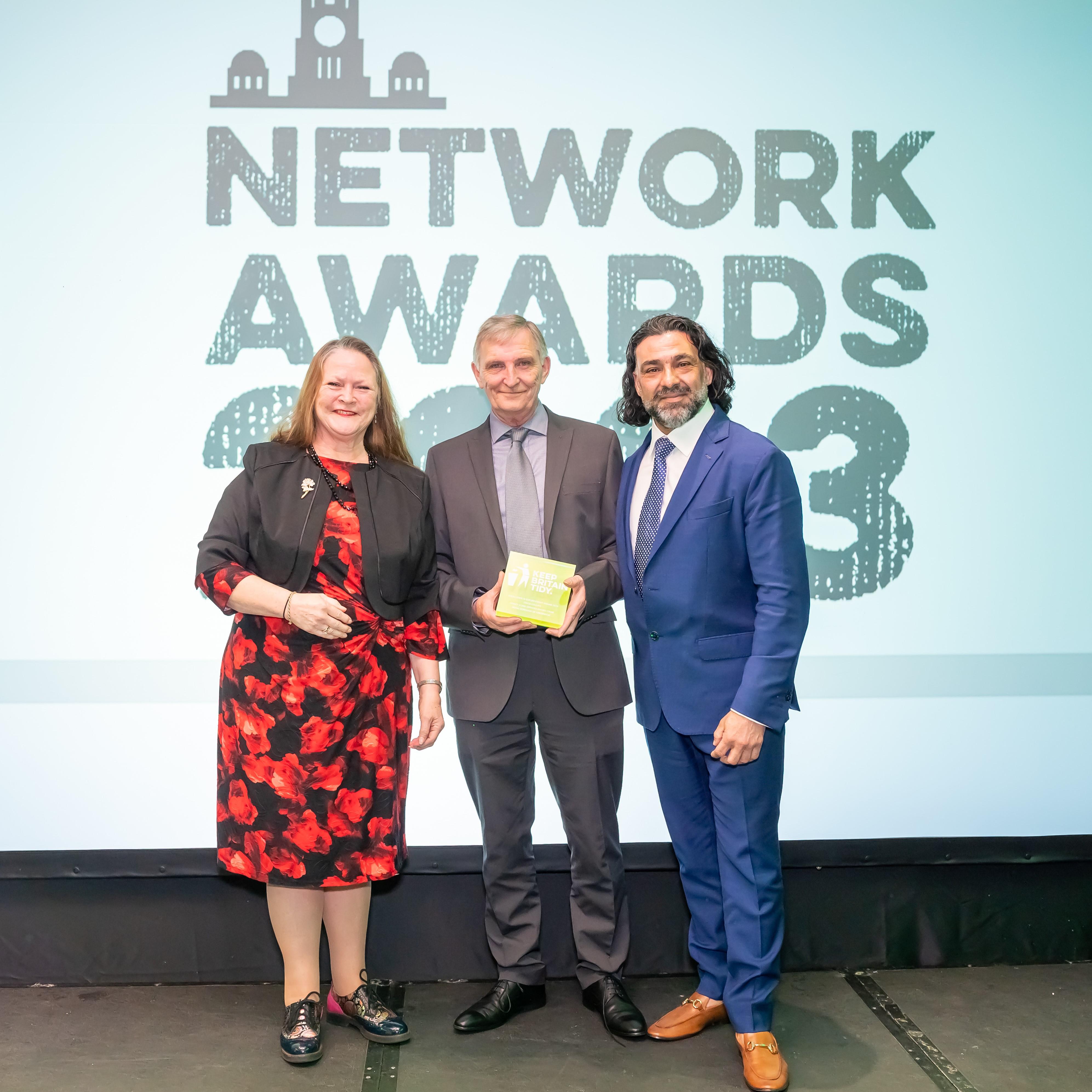 Photograph of three people - two council officers who have won the enforcement award and the CEO of Keep Britain Tidy