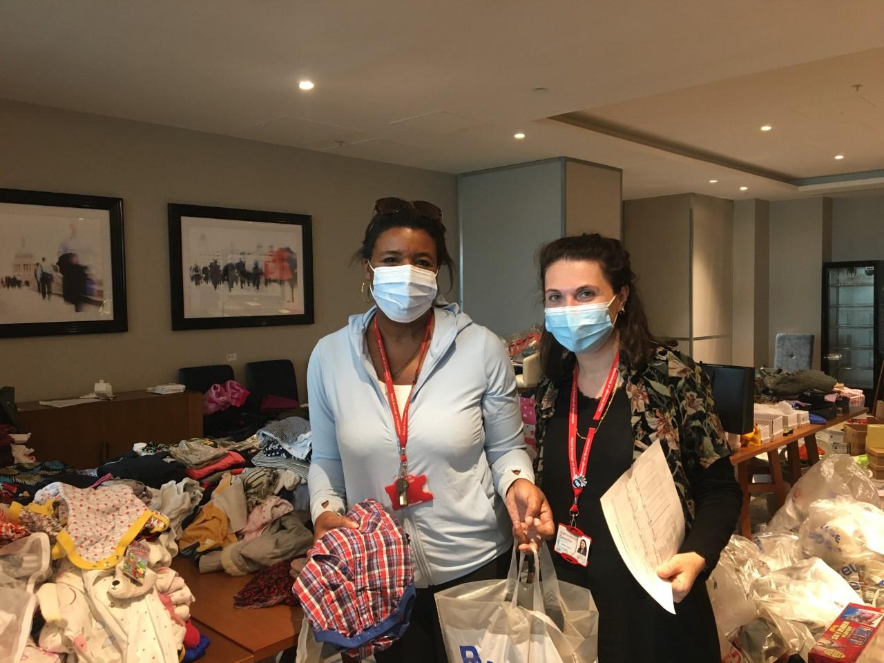 Cllrs Denise Scott-McDonald and Mariam Lolavar sorting donations for refugees