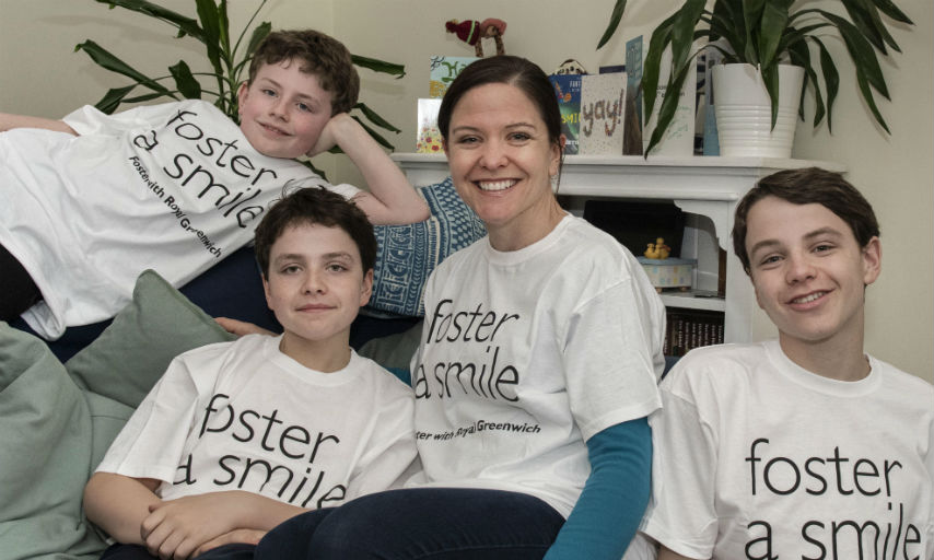 Royal Greenwich Foster Carer Livy Gibbs sitting with her sons in her living room.