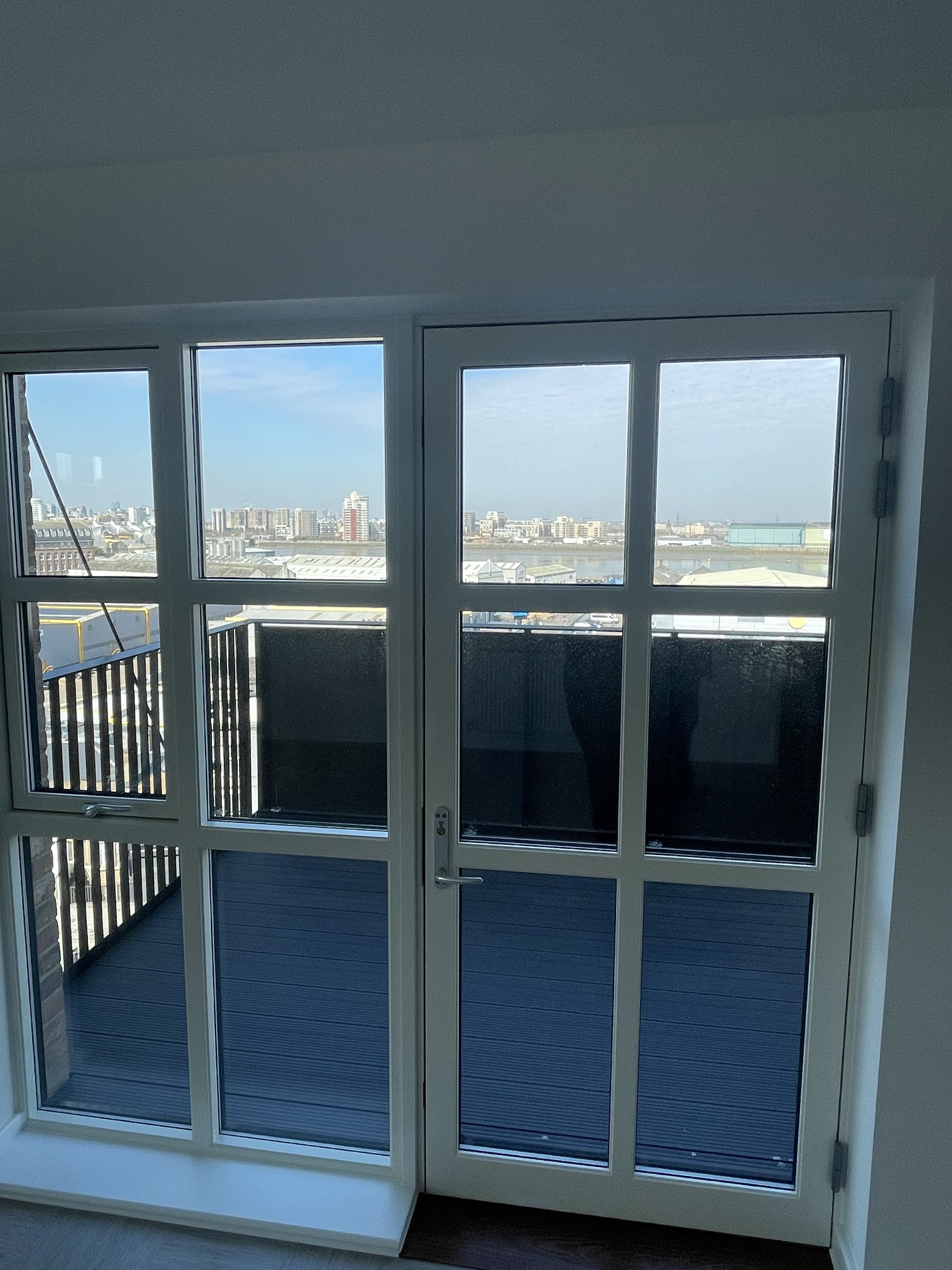 A door leading out to a large balcony.