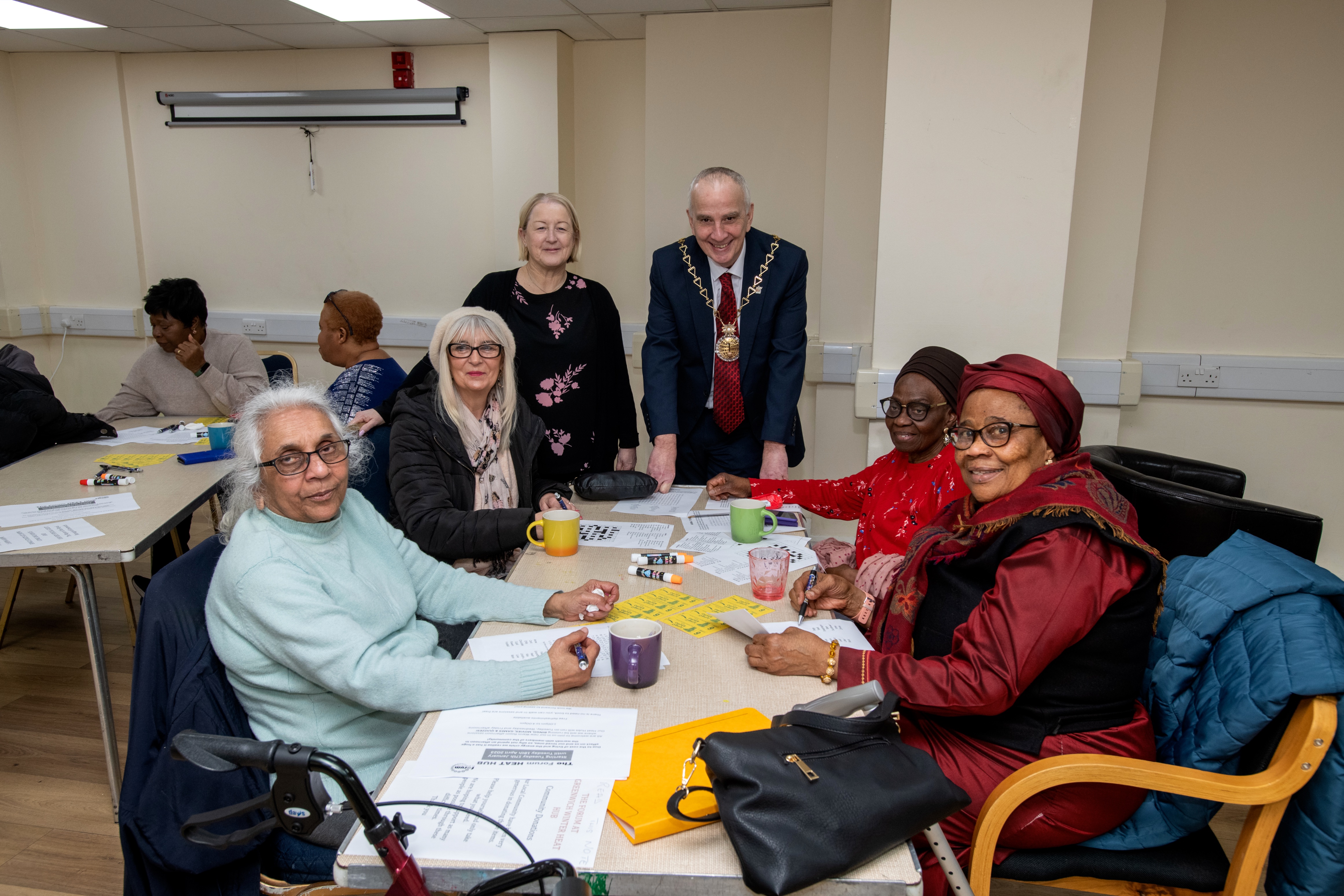 Mayor with people at a warm space