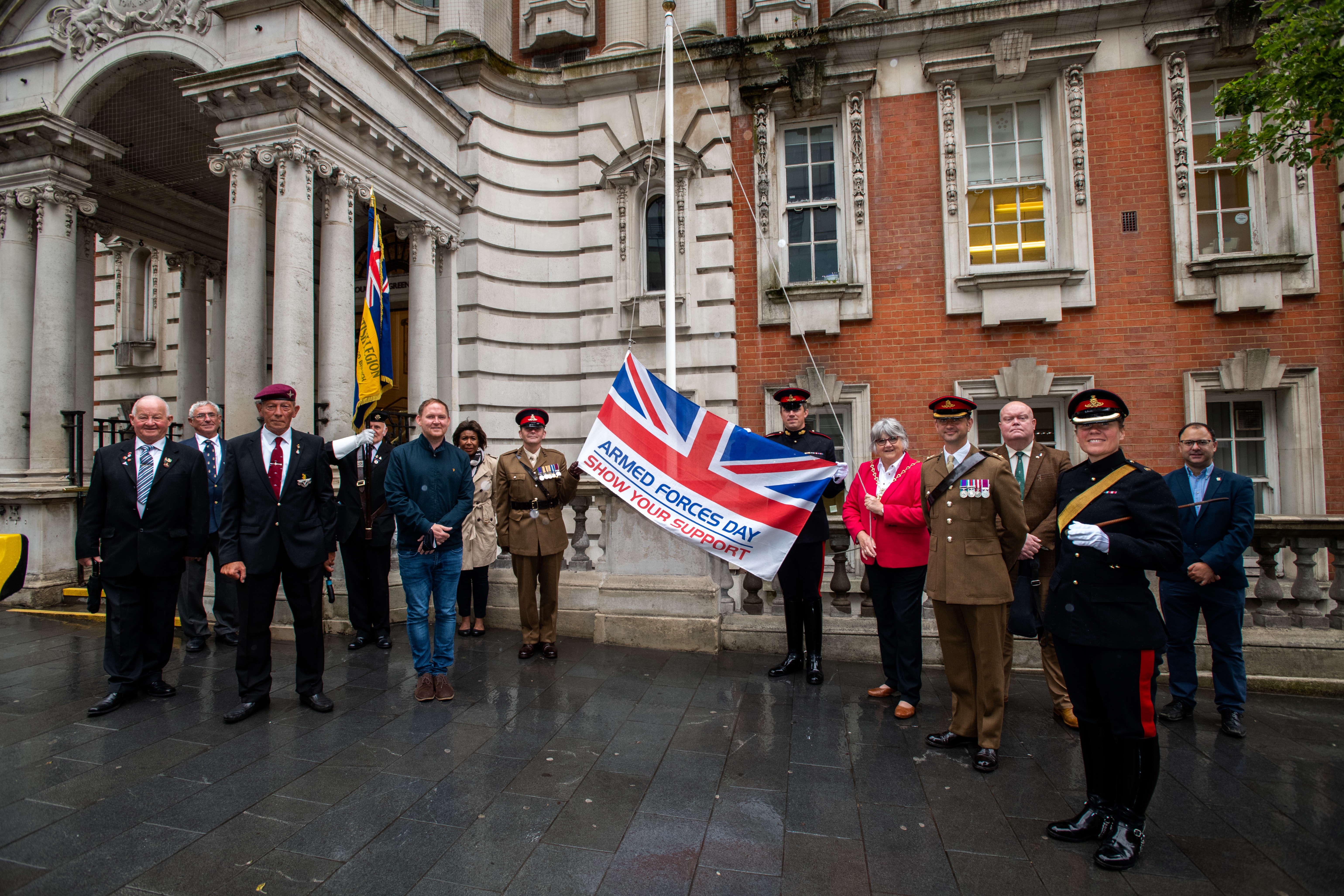 The Armed Forces Day flag being raised above Woolwich Town Hall