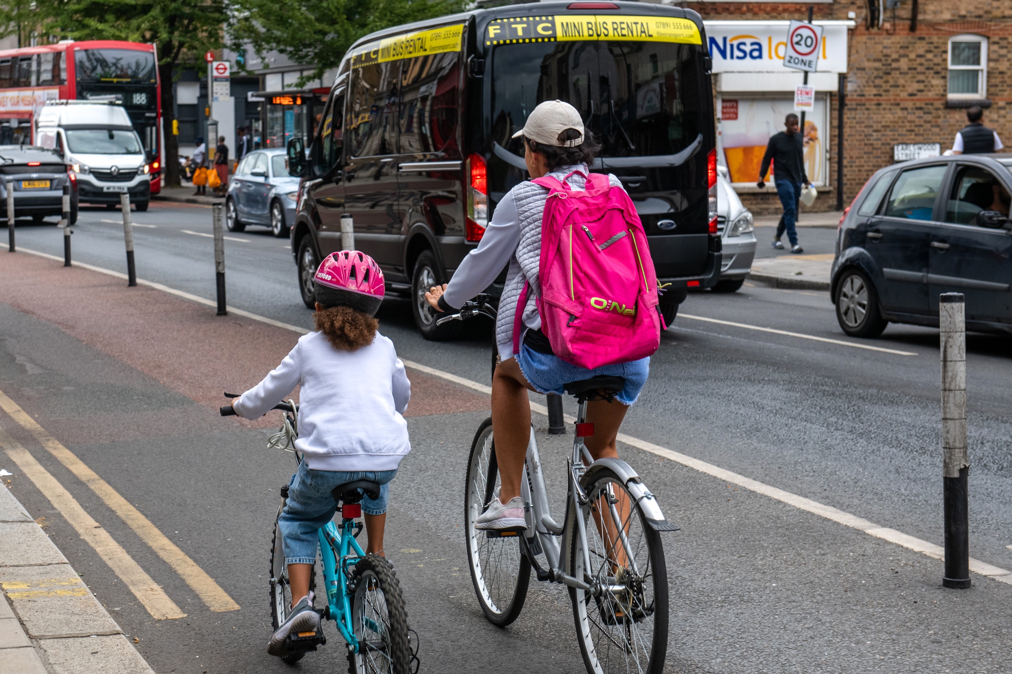 Woman and girl cycling on a Greenwich road