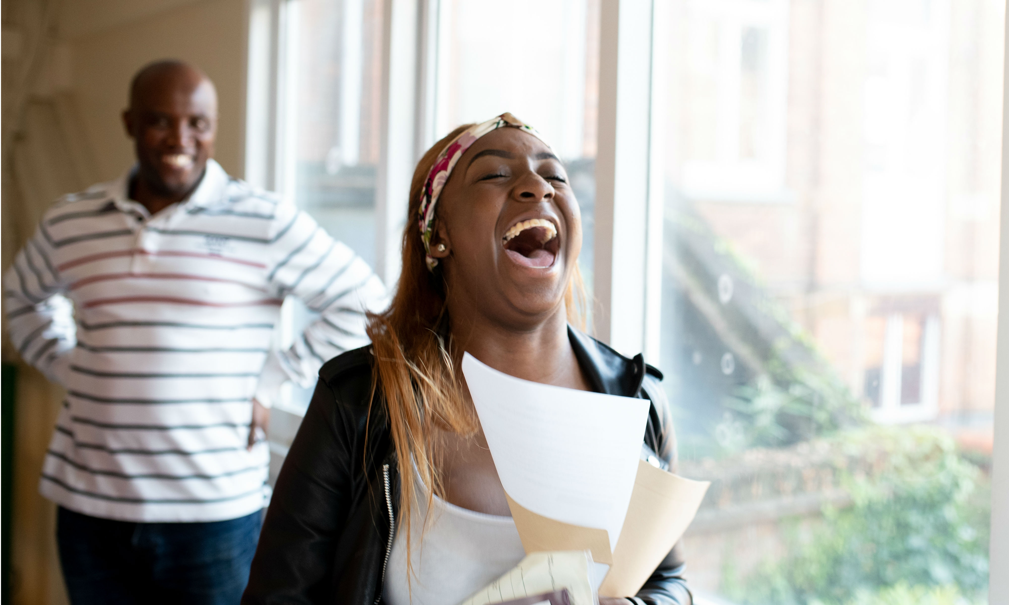 Girl overjoyed with her GCSE results.