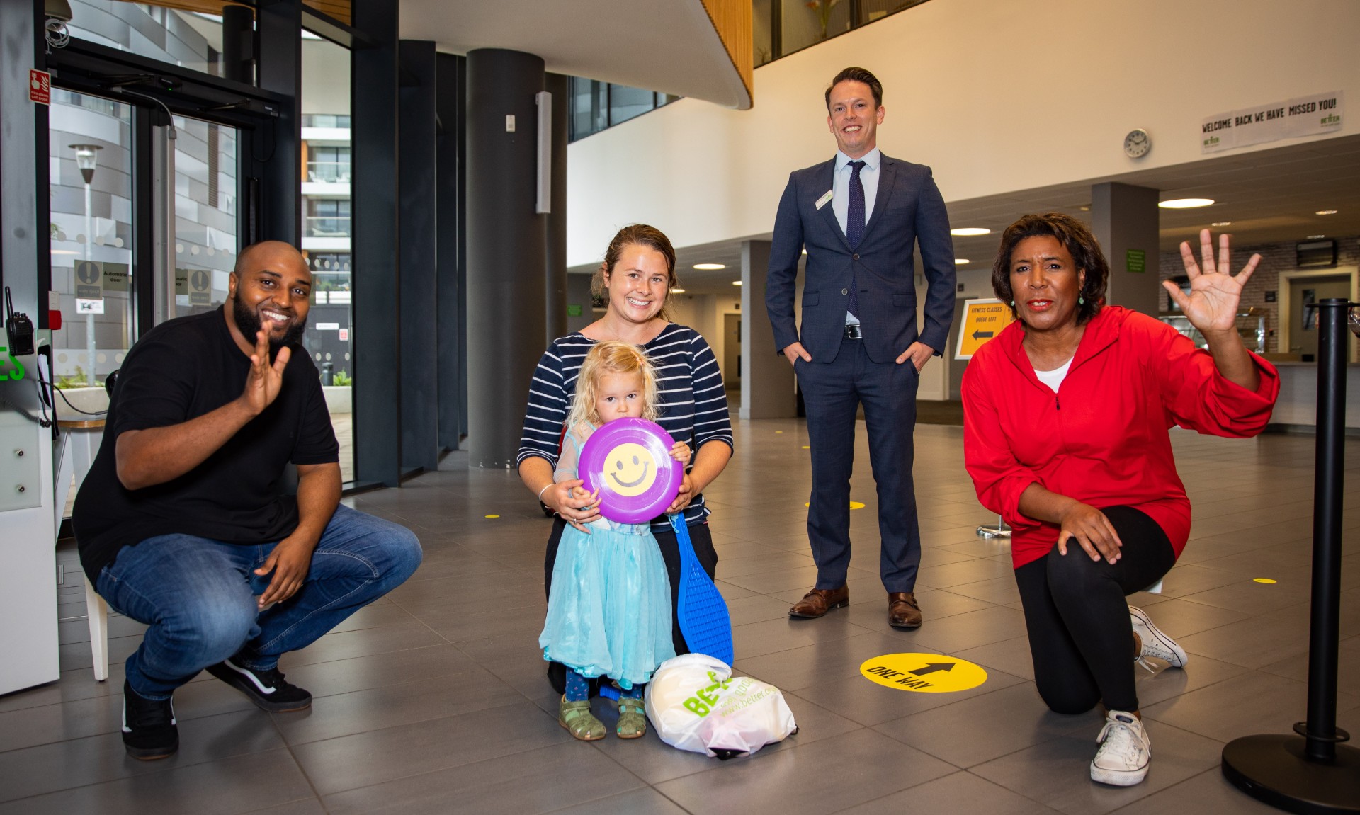 Cllr Adel Khaireh, Cllr Denise Scott-McDonald and a family with a sport pack