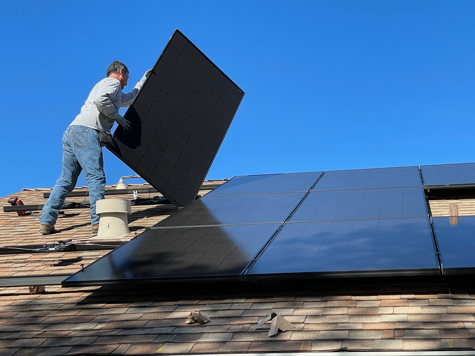 Solar panels being installed on a roof