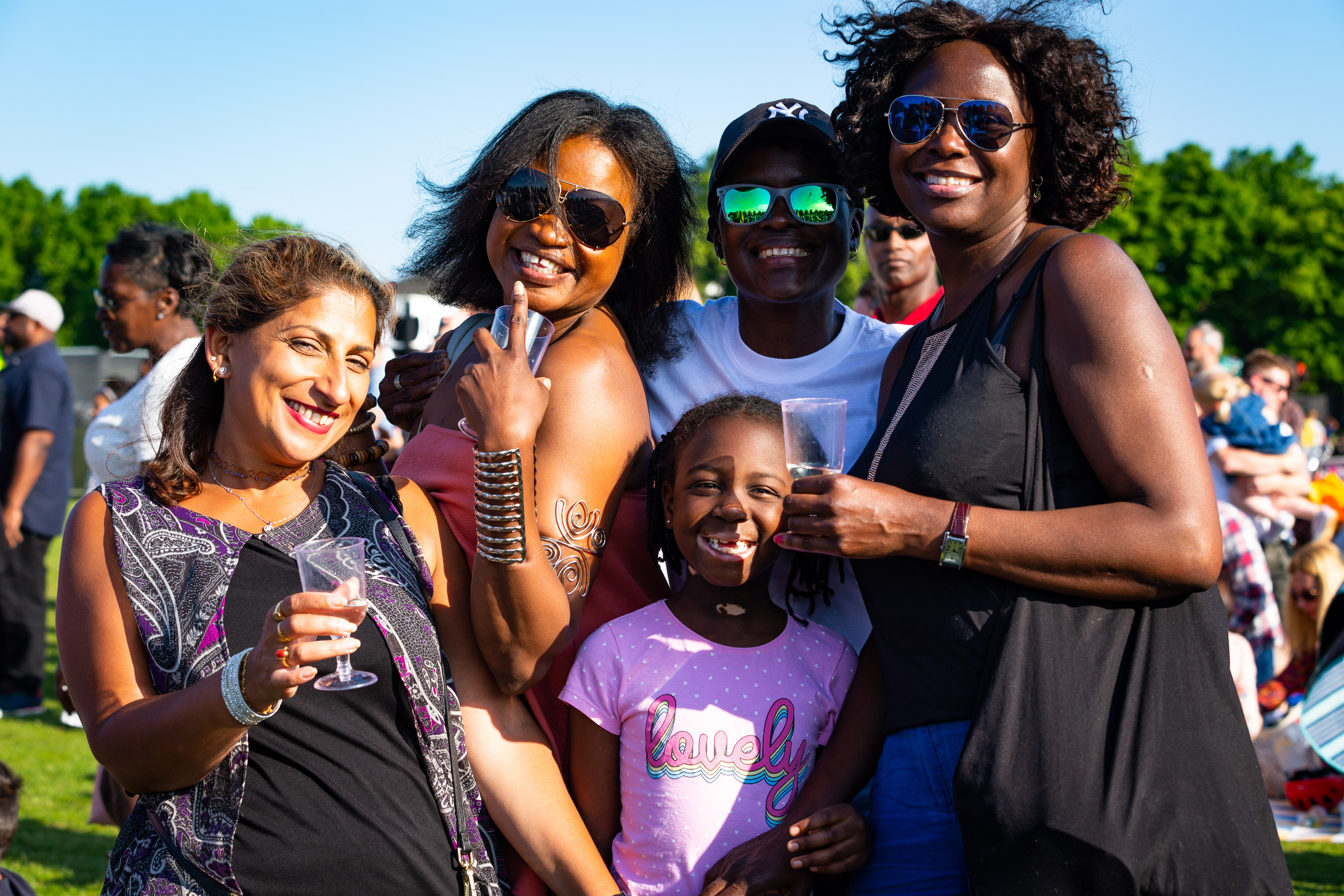 A group of five people pose facing the camera at last year's event, Together 22