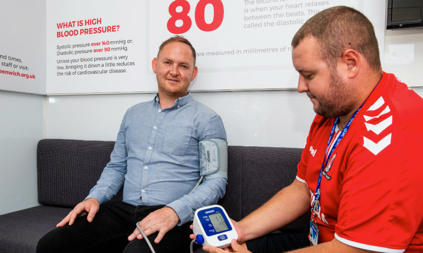 Cllr Danny Thorpe, Leader of the Royal Borough of Greenwich receiving blood pressure check in Woolwich