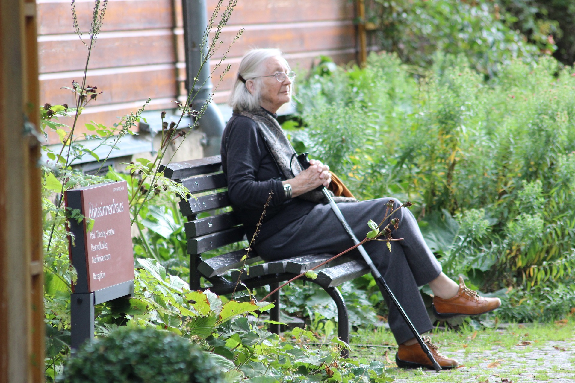 Pensioner sat on a park bench