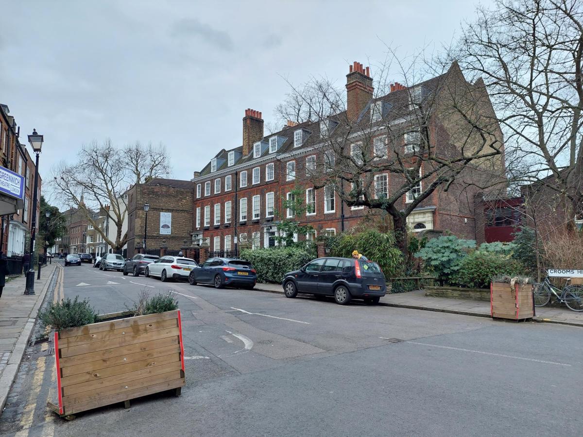 street view of parked cars on road