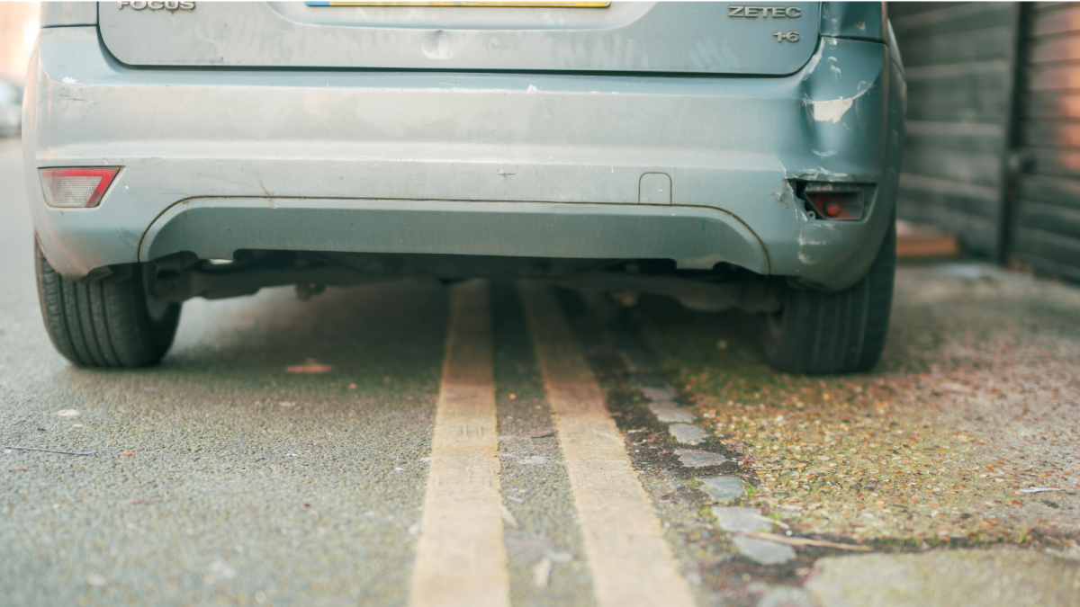 car parked by double yellow line