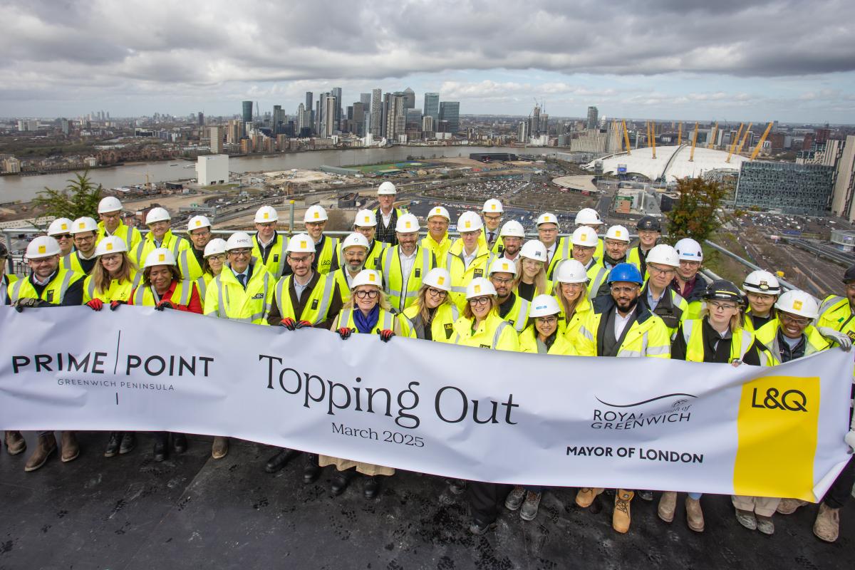 A group picture with representatives from Royal Borough of Greenwich, Greater London Authority and L&Q to mark the topping out at Prime Point