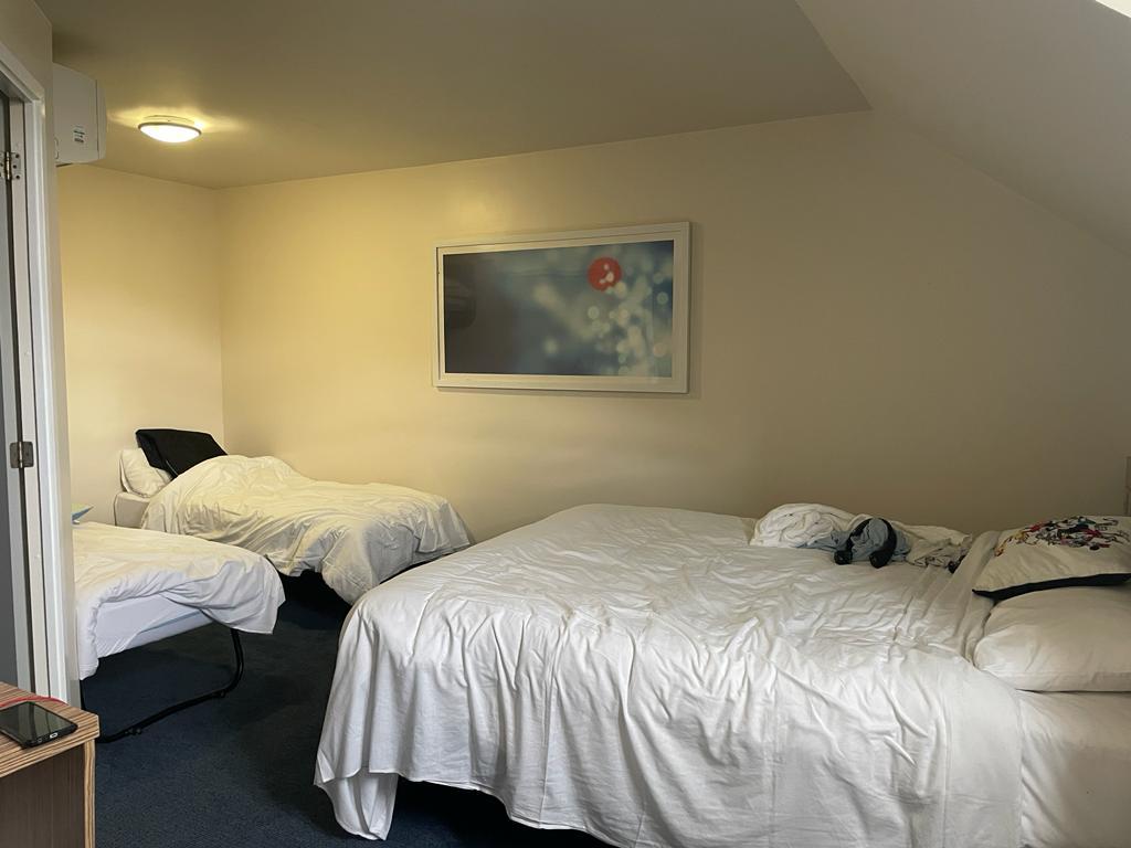 two empty beds in a room