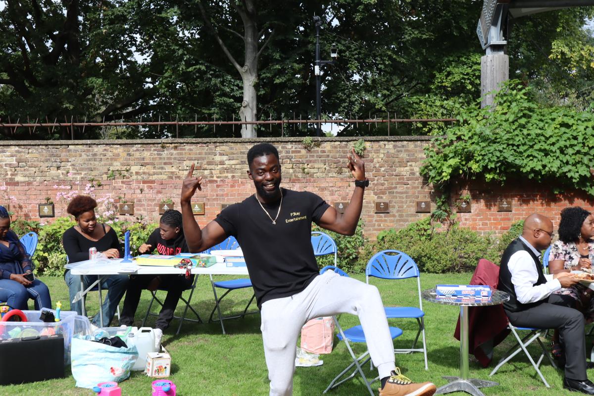 A person dancing outside in a garden