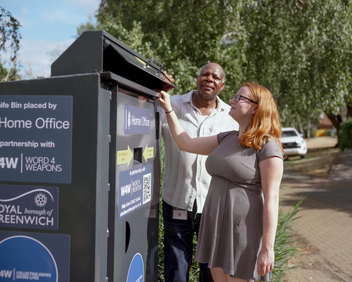 Cllr Rachel Taggart-Ryan and Cllr Olu Babatola looking into the Thamesmead weapon surrender bin