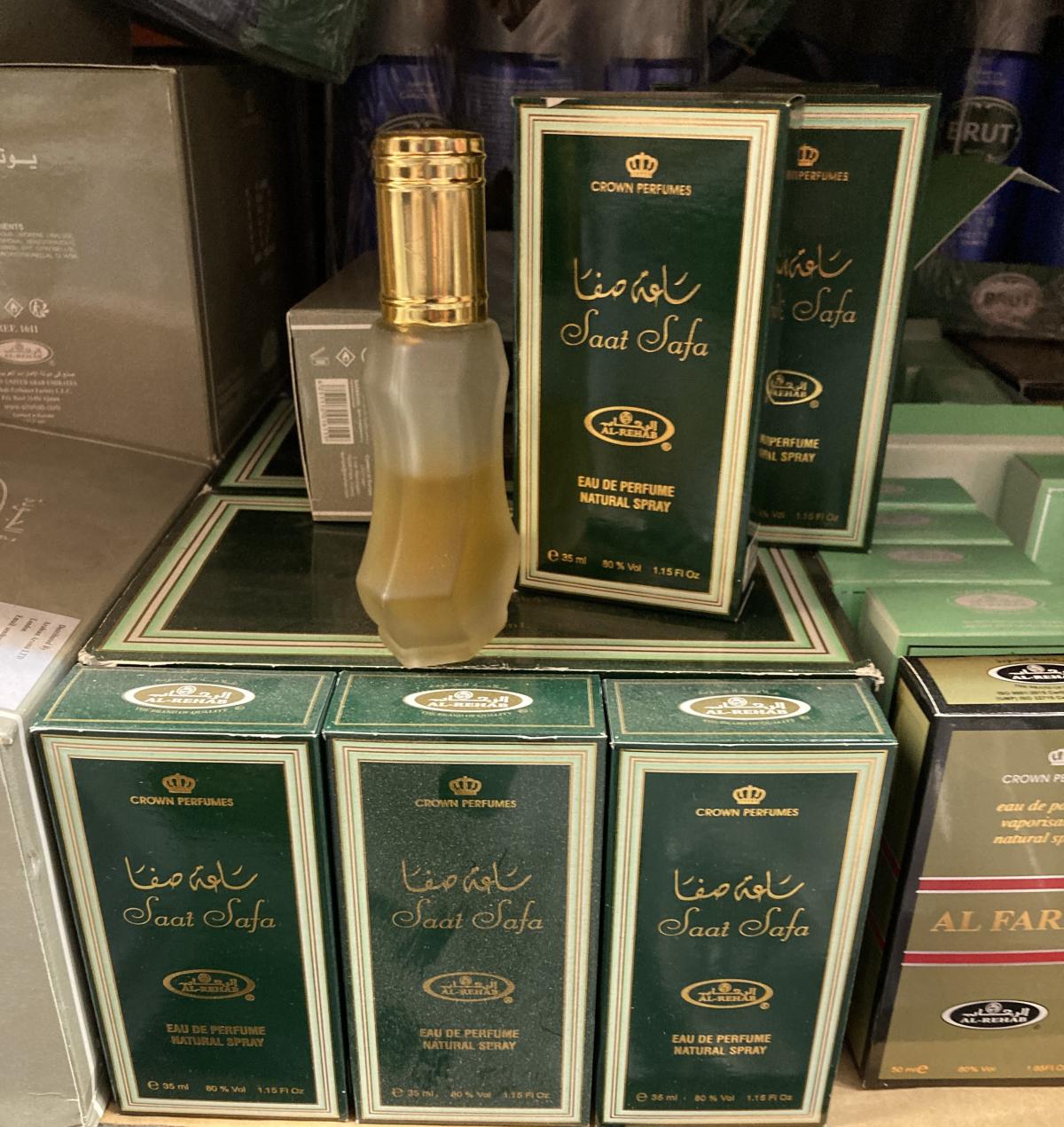 Stacked boxes of perfume with a tester bottle on the top.