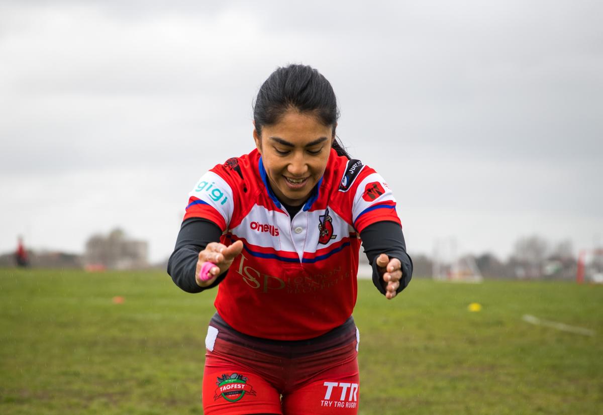 Woman doing a warm up before a rugby game