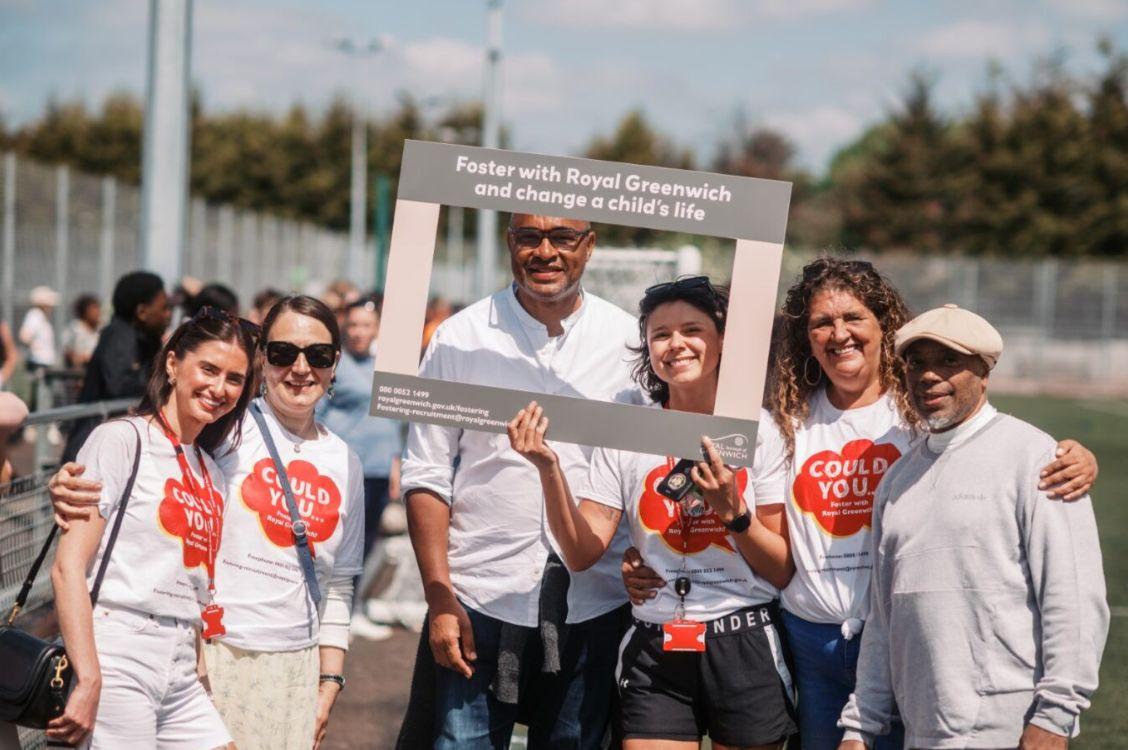 Staff and foster carers at a football match in aid of fostering awareness