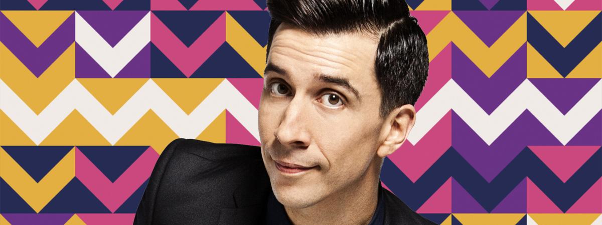 A man with short black hair looking at the camera (comedian Russell Kane)