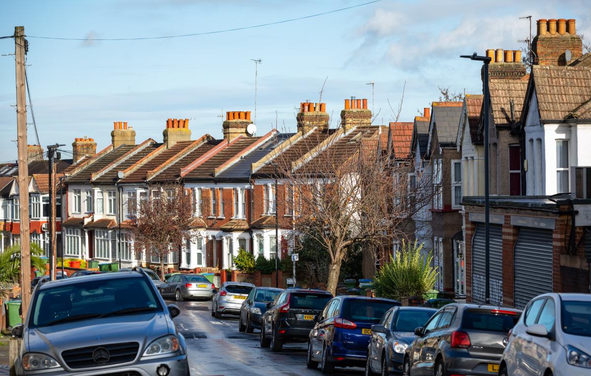 A row of houses along a residential road.