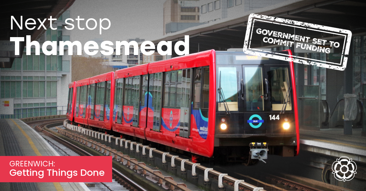 A DLR train at a platform with the caption "Next stop Thamesmead"