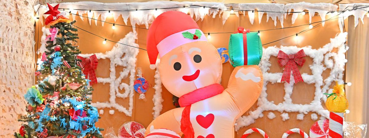 An inflatbale gingerbread man in a colourful grotto