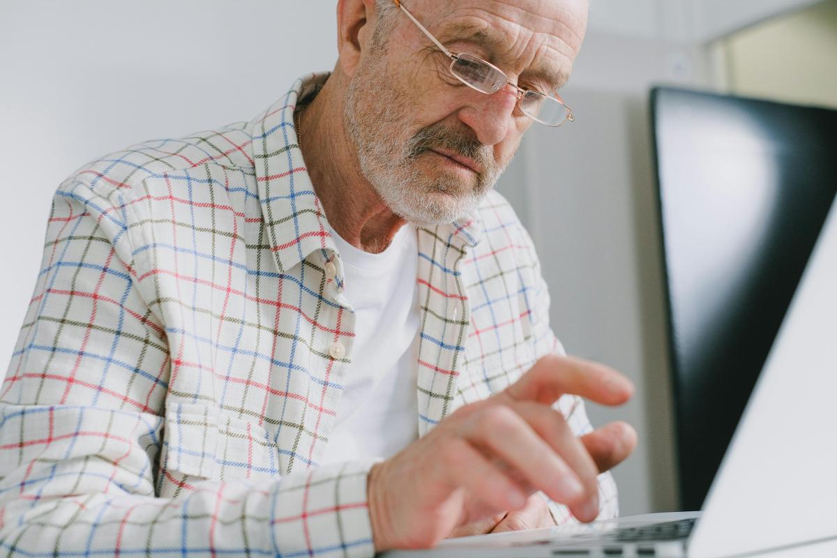 Elderly man using a laptop