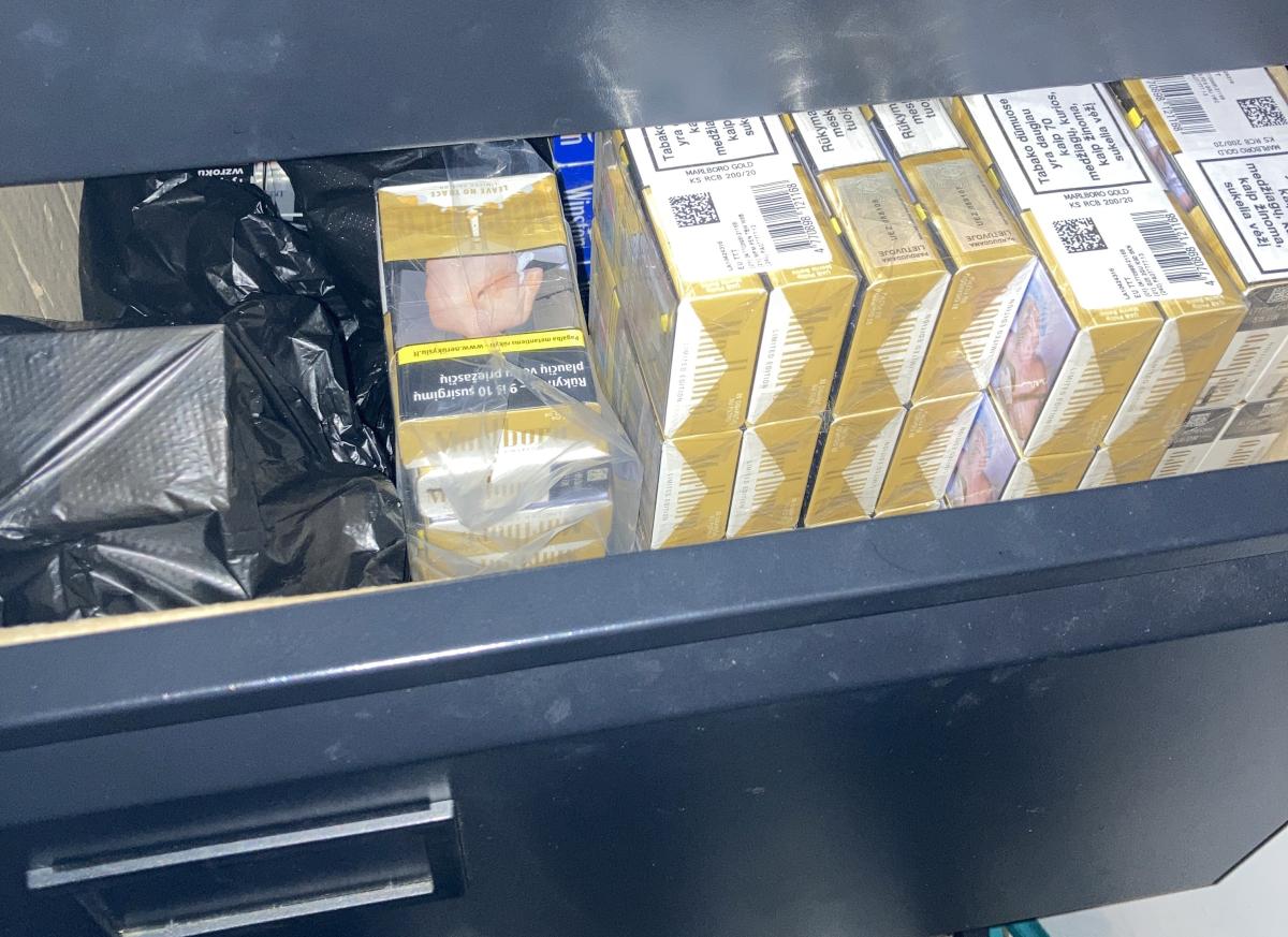 Packets of cigarettes in a drawer