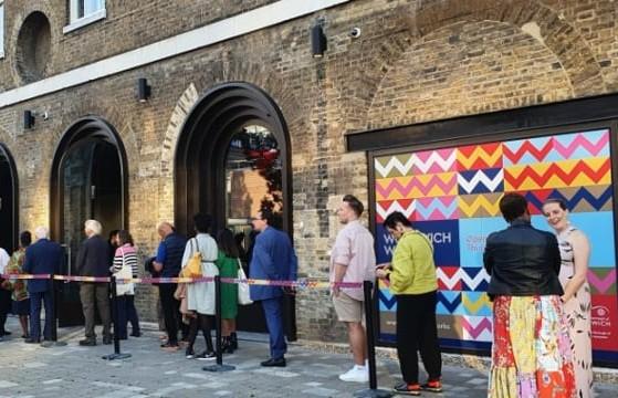 An image of people queuing at Woolwich Works