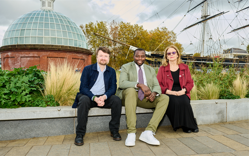 A photo of three councillors sitting by the Cutty Sark