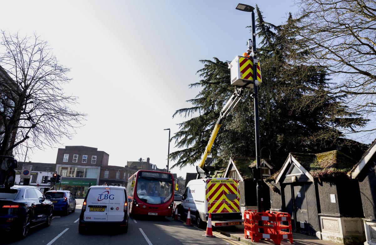 A cherry picker installing a new CCTV camera on Eltham High Street