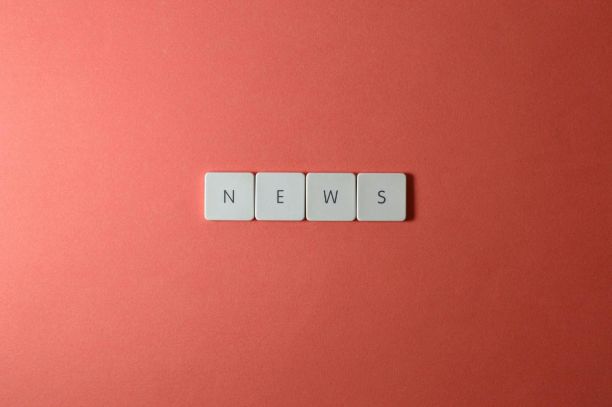 red square with the word News spelt using scrabble tiles