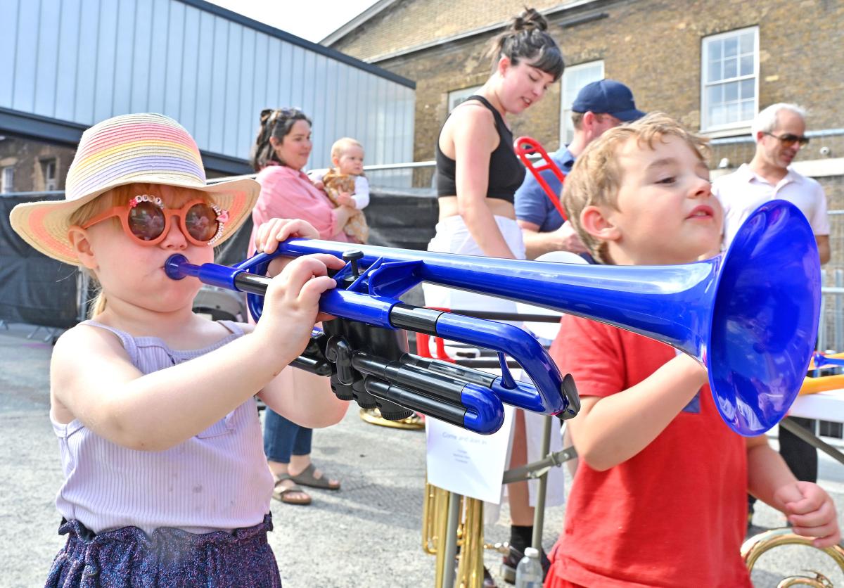 A child playing a plastic trumpet