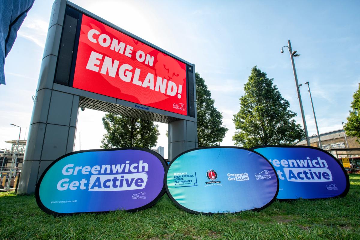 A big screen with the word 'Come on England' on it. 