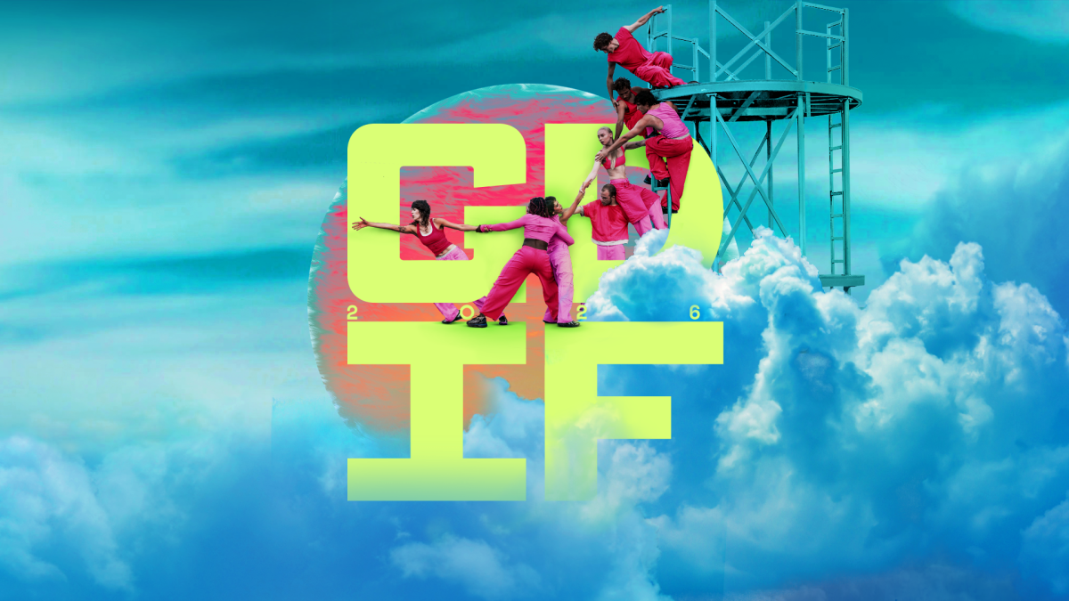 Dancers wearing pink climbing a metal frame. The background is blue clouds. The text reads 'GDIF'