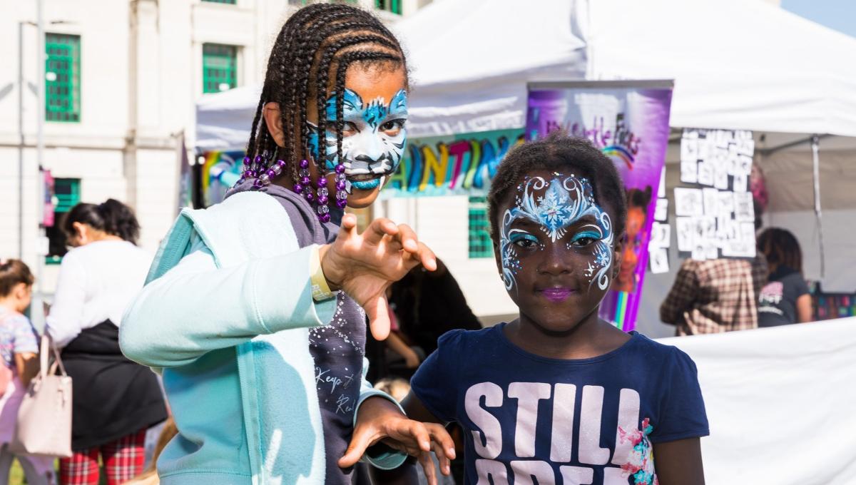 Two children wearing face paint